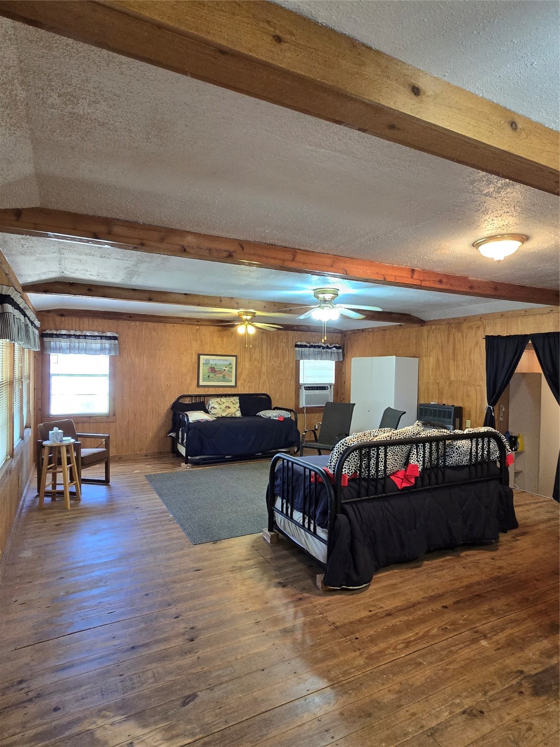 206 Tallow Street Onalaska, TX 77360 - Photo 7 of 25 a living room with furniture and a flat screen tv