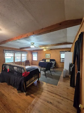 a bedroom with furniture and window