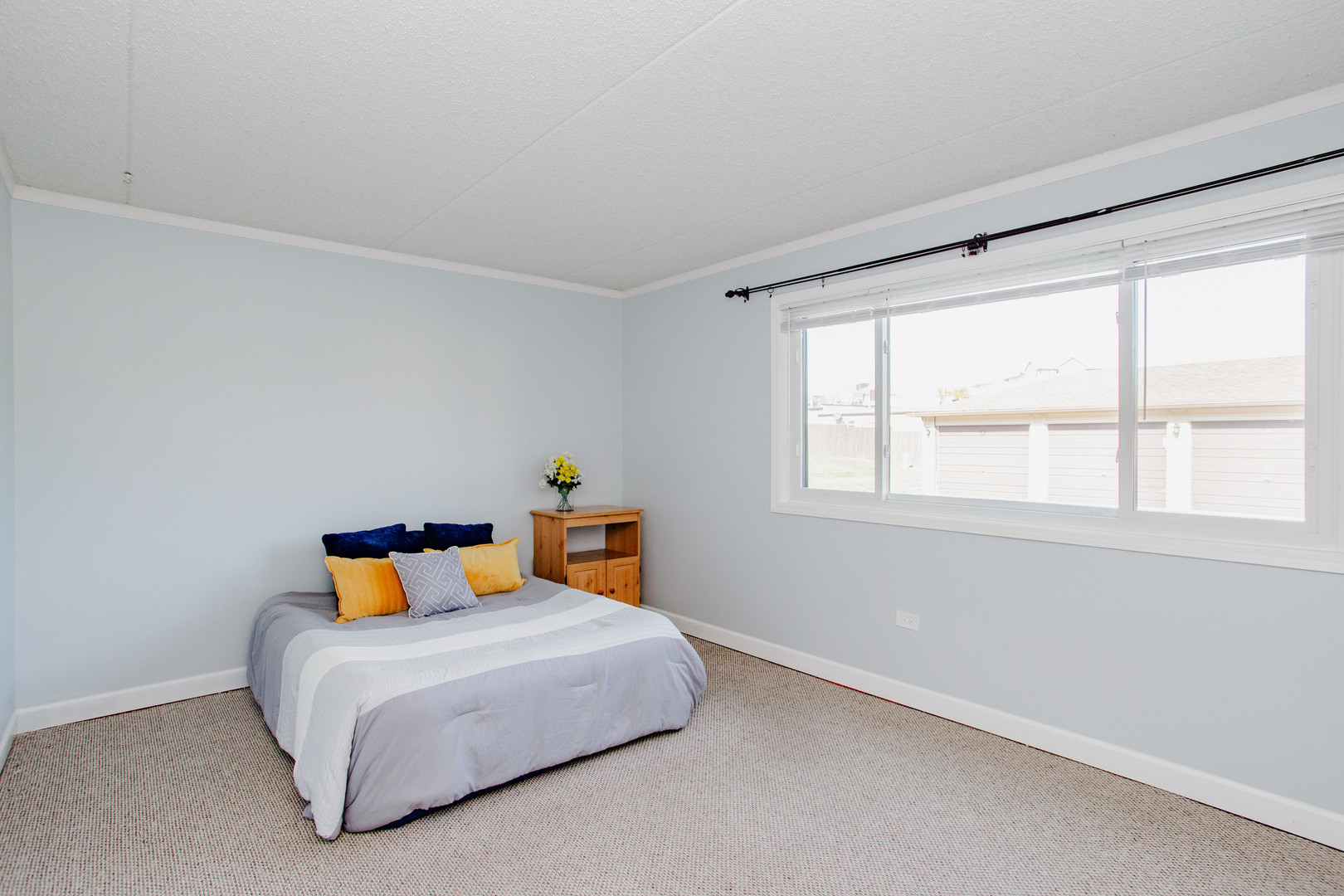 1215 Chalet Road, Unit 101 Naperville, IL 60563 - Photo 12 of 36 a bedroom with a bed and window