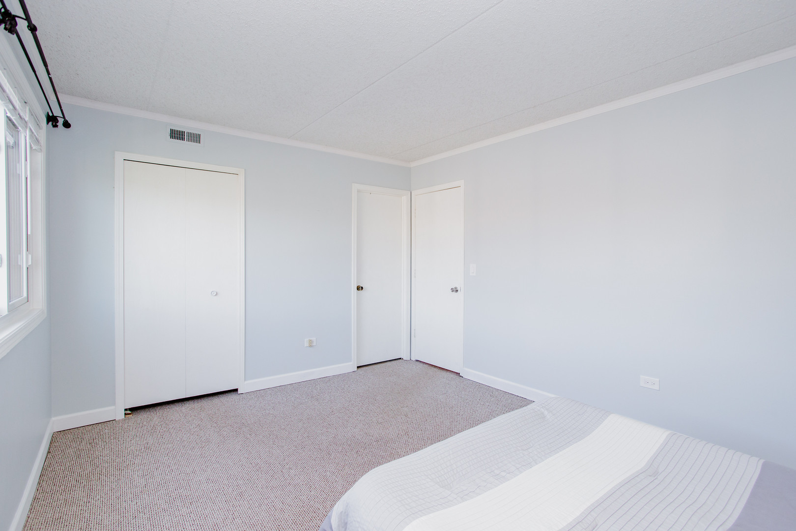 1215 Chalet Road, Unit 101 Naperville, IL 60563 - Photo 13 of 36 a bedroom with a bed and a window
