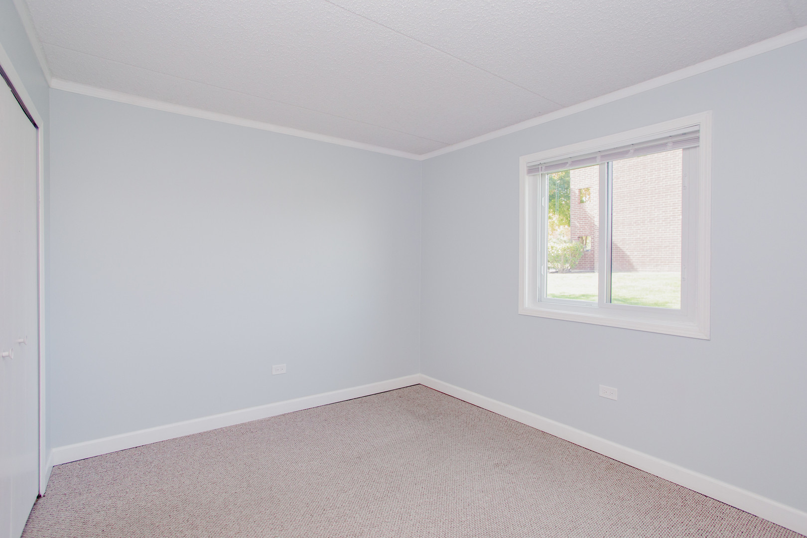 1215 Chalet Road, Unit 101 Naperville, IL 60563 - Photo 14 of 36 an empty room with a window