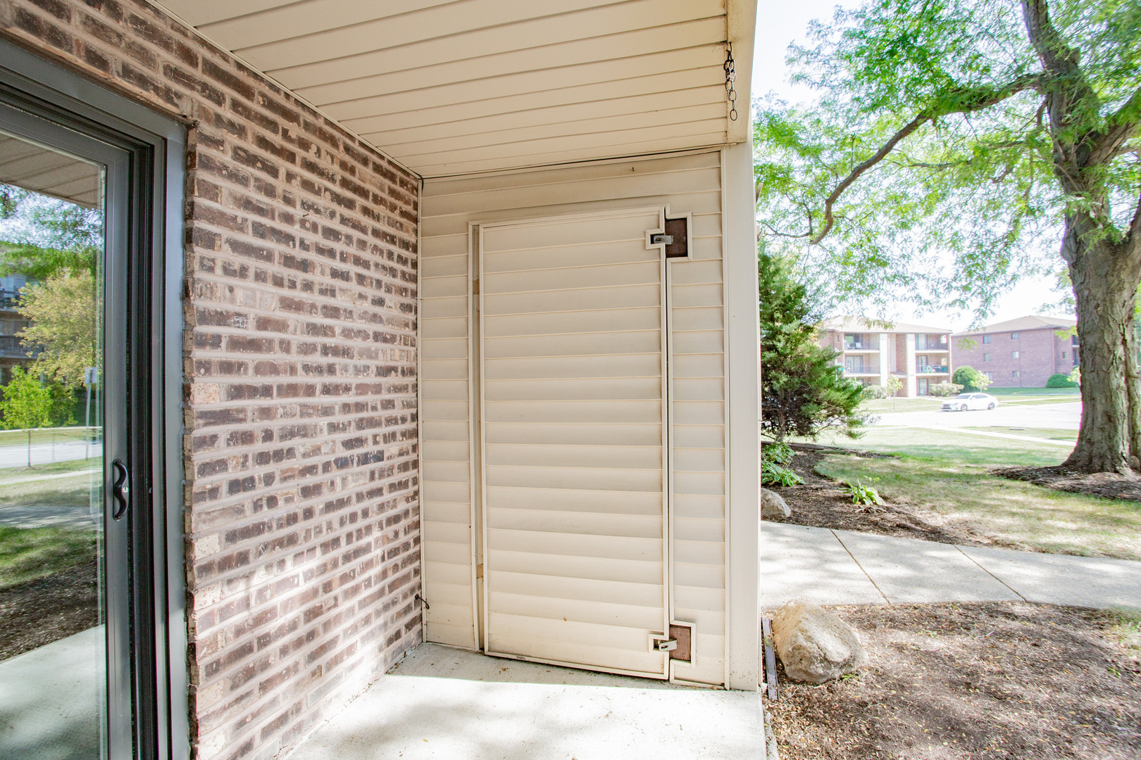 1215 Chalet Road, Unit 101 Naperville, IL 60563 - Photo 20 of 36 a view of a back yard of the house