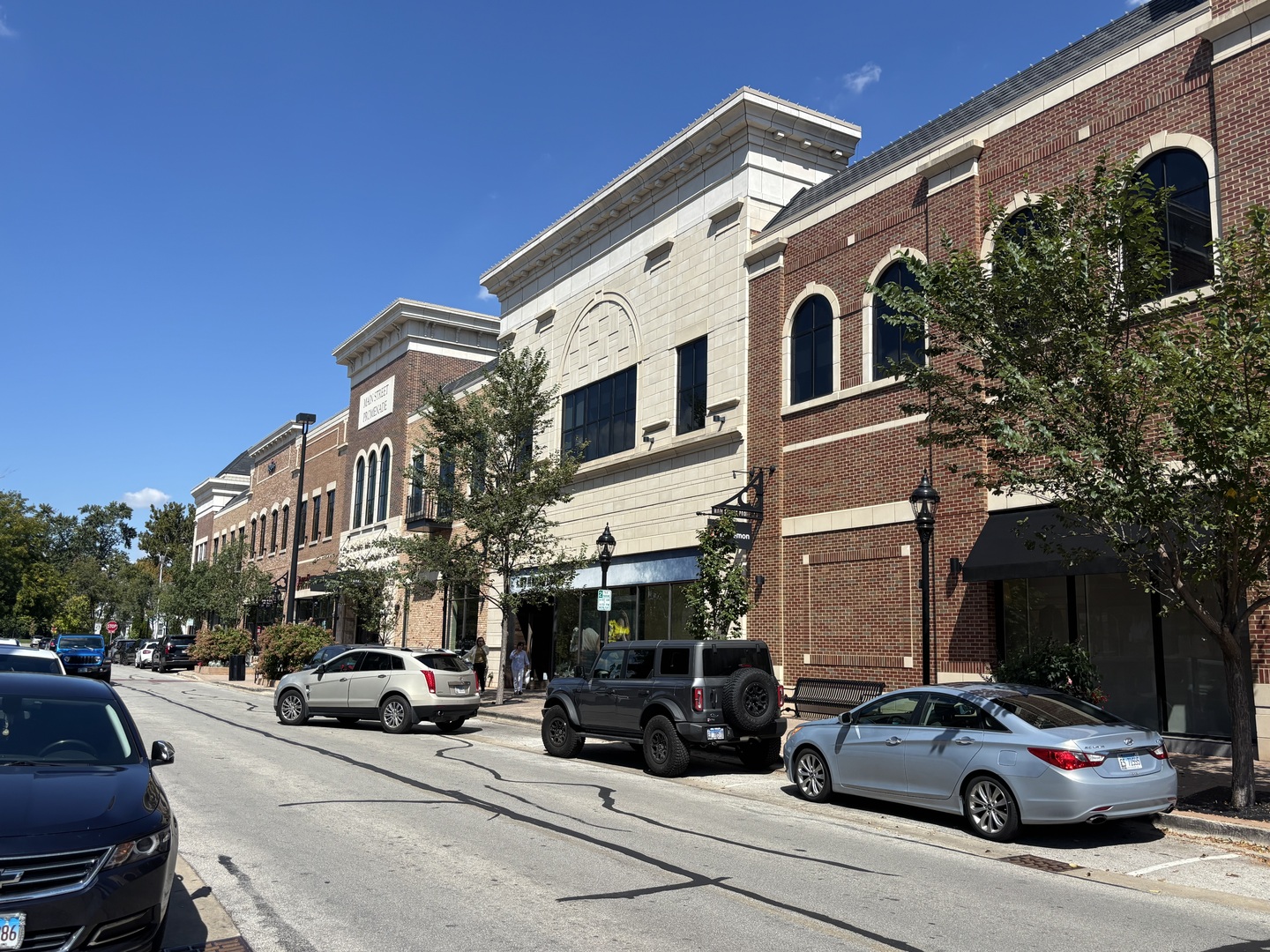 1215 Chalet Road, Unit 101 Naperville, IL 60563 - Photo 33 of 36 a view of a cars park in front of a building