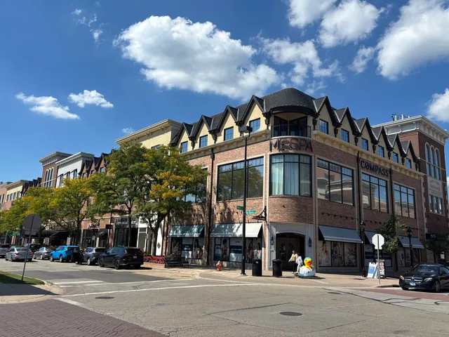 a front view of a building with a street