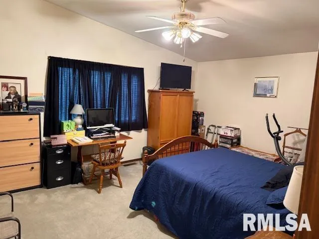 a bedroom with a bed and furniture