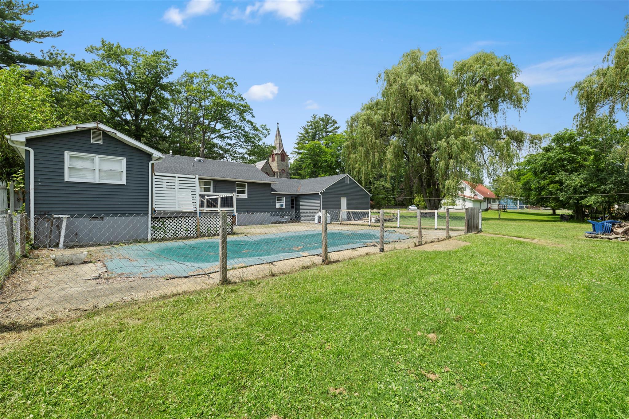 44 Woods Road Tivoli, NY 12583 - Photo 17 of 25 a house is sitting in middle od the grass