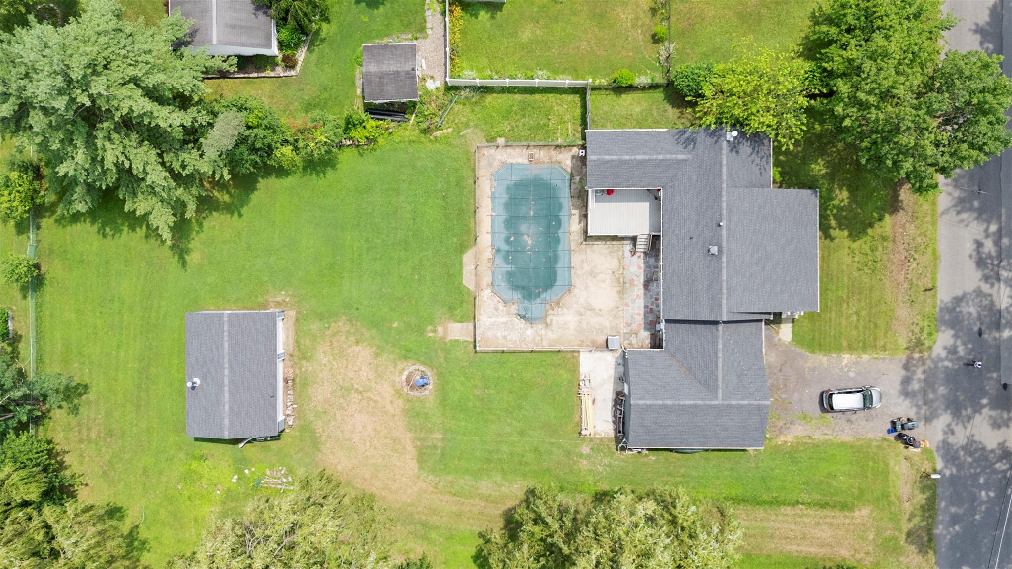 44 Woods Road Tivoli, NY 12583 - Photo 22 of 25 an aerial view of a house with a garden and trees