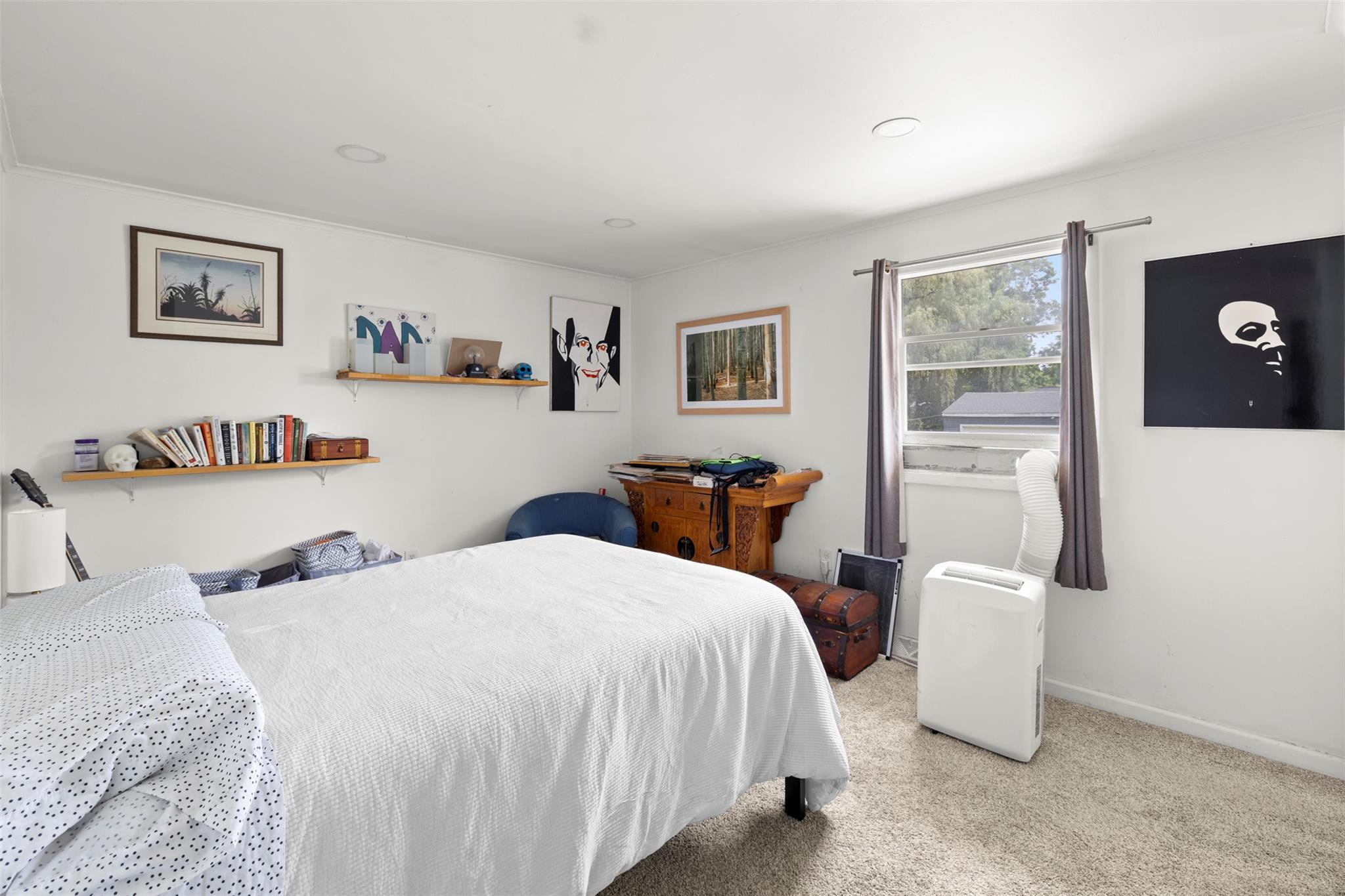 44 Woods Road Tivoli, NY 12583 - Photo 7 of 25 a bedroom with a bed and a large mirror on a dresser