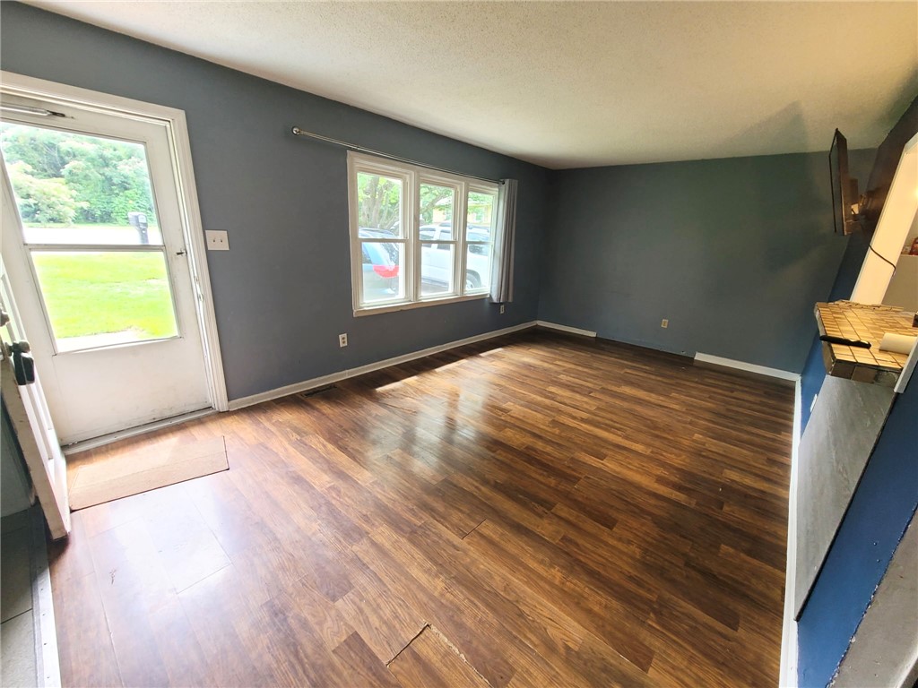 110 Ridgemont Court Greenwood, SC 29649 - Photo 2 of 14 Natural light illuminates rich hardwood flooring in this cozy living space.