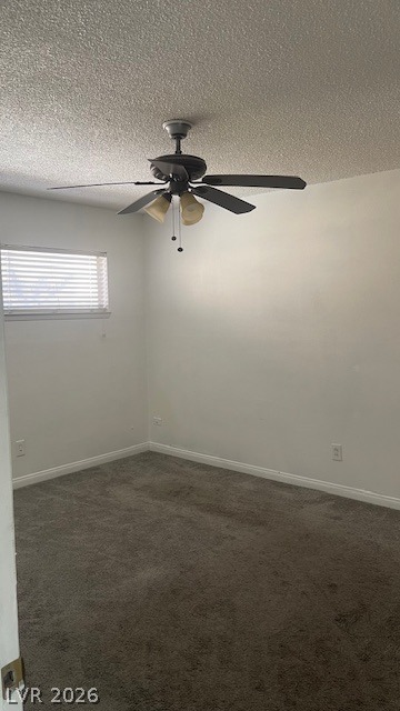 350 East Desert Inn Road, Unit B103 Las Vegas, NV 89109 - Photo 16 of 22 A well-lit bedroom features plush carpeting and a modern ceiling fan, offering comfortable living.