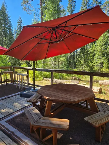 a view of a chairs and table in the patio