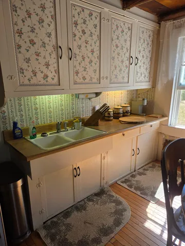 a stove top oven sitting inside of a kitchen