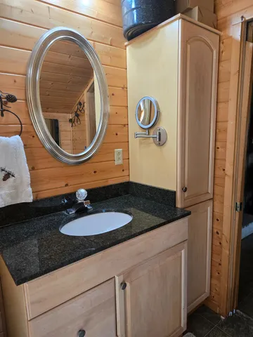 a view of a garage with a bike and wooden roof