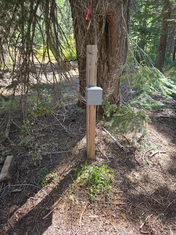 a view of backyard with swimming pool and outdoor seating