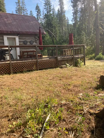a view of house with a yard
