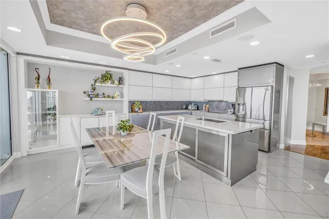 a open kitchen with stainless steel appliances granite countertop a sink and cabinets