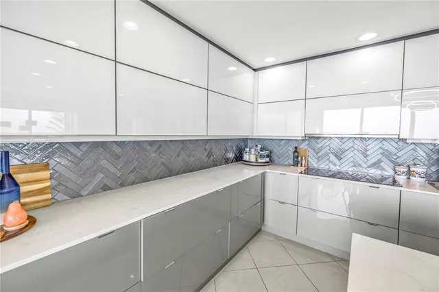 a bedroom with a bed and glass windows