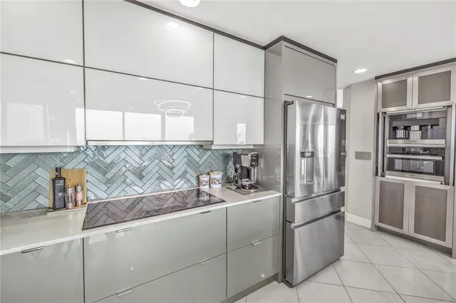 a white bath tub sitting next to a shower