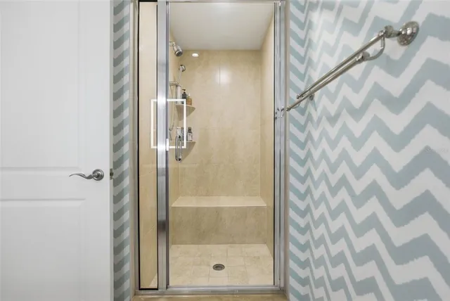 a kitchen with a sink and a mirror