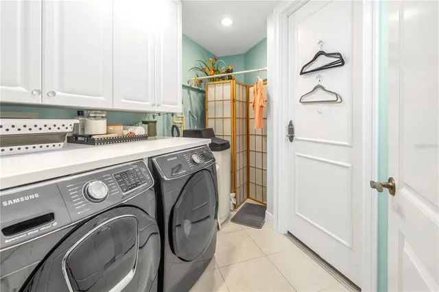 a living room with furniture and large window