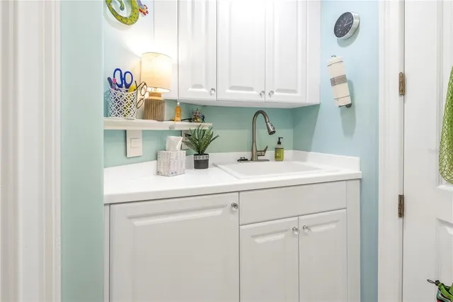 a view of a living room and kitchen