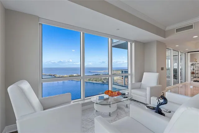 a kitchen with a table chairs and entryway
