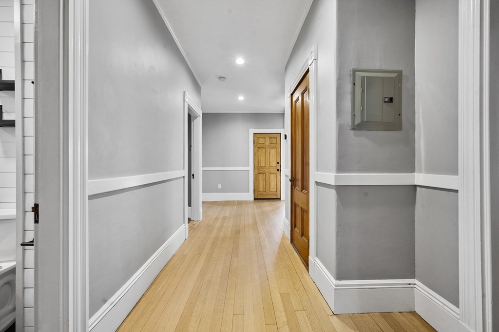 43 Robinson Street, Unit 3 Boston, MA 02122 - Photo 29 of 42 a view of a hallway with wooden floor and staircase