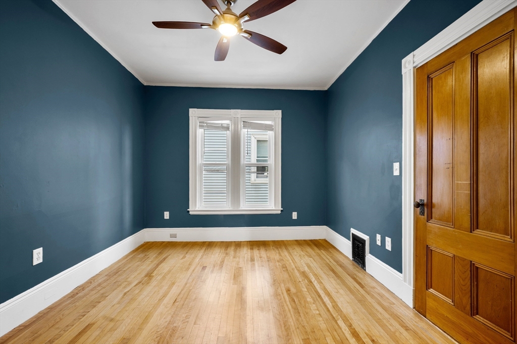 43 Robinson Street, Unit 3 Boston, MA 02122 - Photo 30 of 42 a view of a room with wooden floor and fan