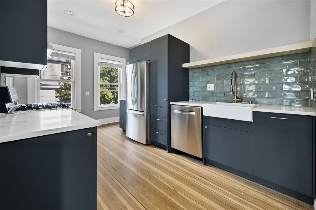 43 Robinson Street, Unit 3 Boston, MA 02122 - Photo 3 of 42 a kitchen with stainless steel appliances granite countertop a refrigerator a sink and a stove