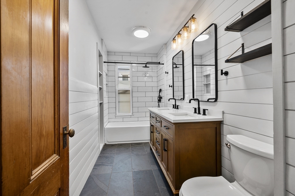 43 Robinson Street, Unit 3 Boston, MA 02122 - Photo 36 of 42 a bathroom with a sink toilet double vanity and tub