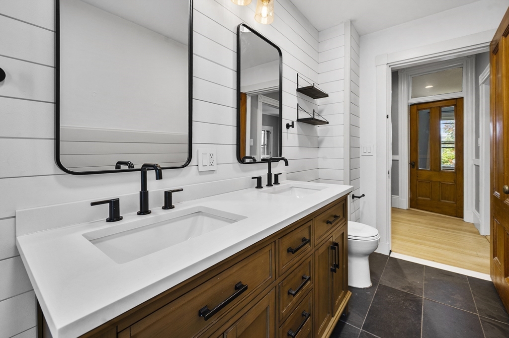 43 Robinson Street, Unit 3 Boston, MA 02122 - Photo 37 of 42 a bathroom with a sink and a mirror