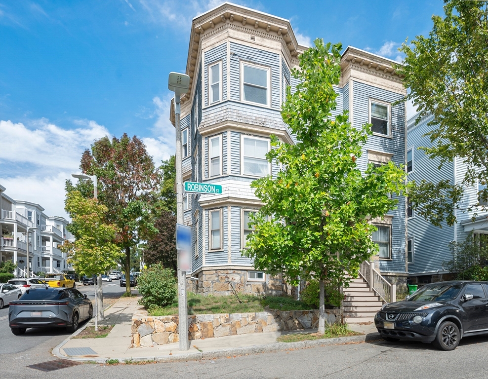43 Robinson Street, Unit 3 Boston, MA 02122 - Photo 41 of 42 a car parked in front of a building