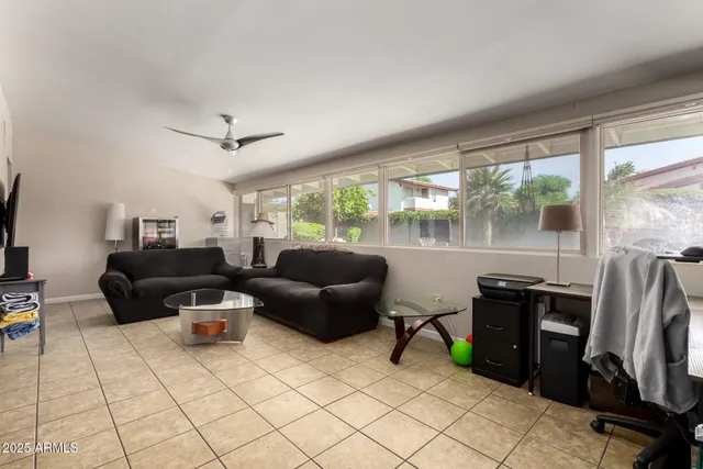 a living room with fireplace furniture and a flat screen tv