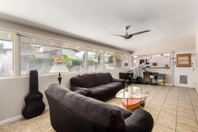 a living room with furniture and a large window