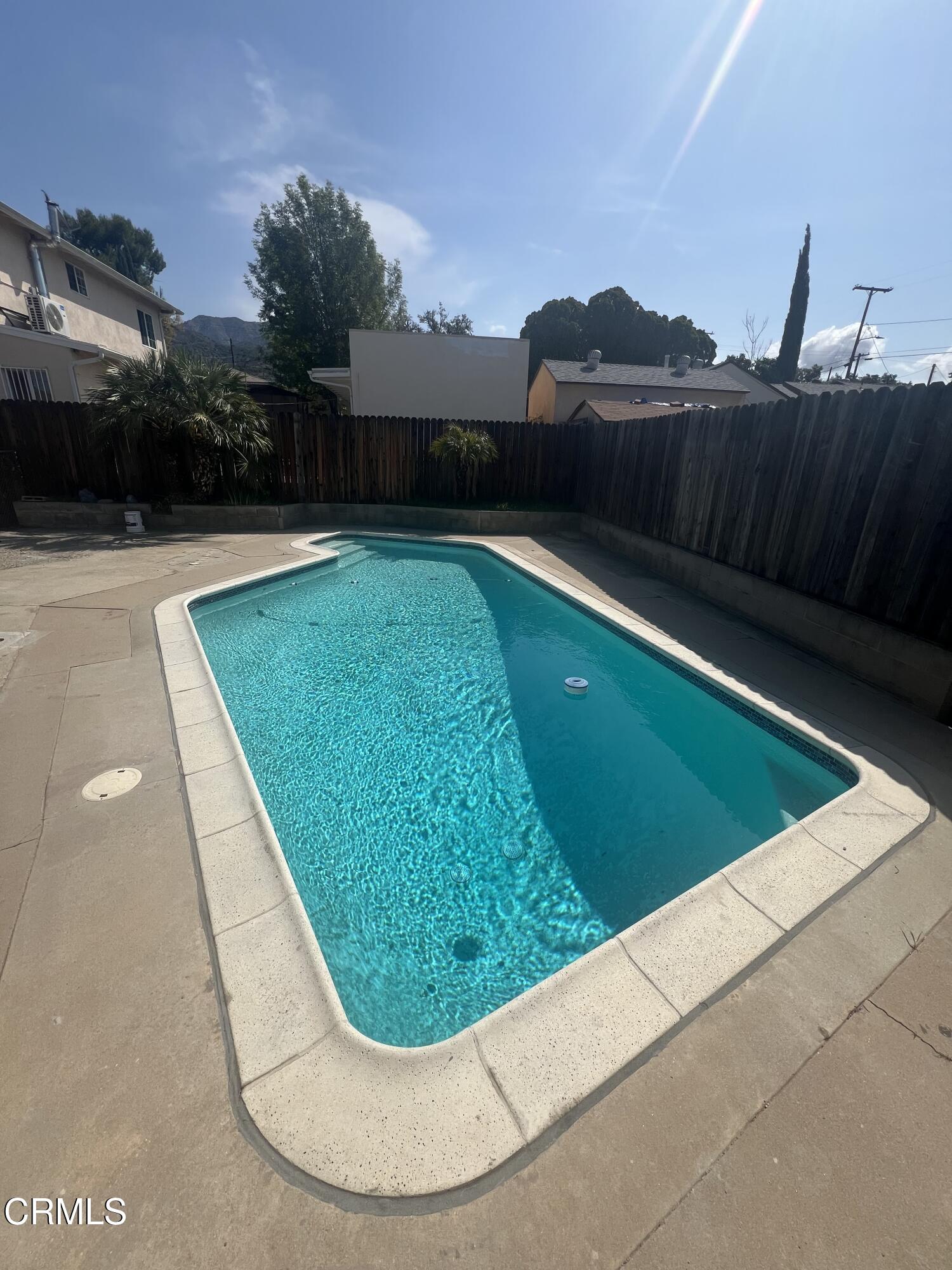 7618 Summitrose Street Tujunga, CA 91042 - Photo 15 of 15 a view of a swimming pool with a yard