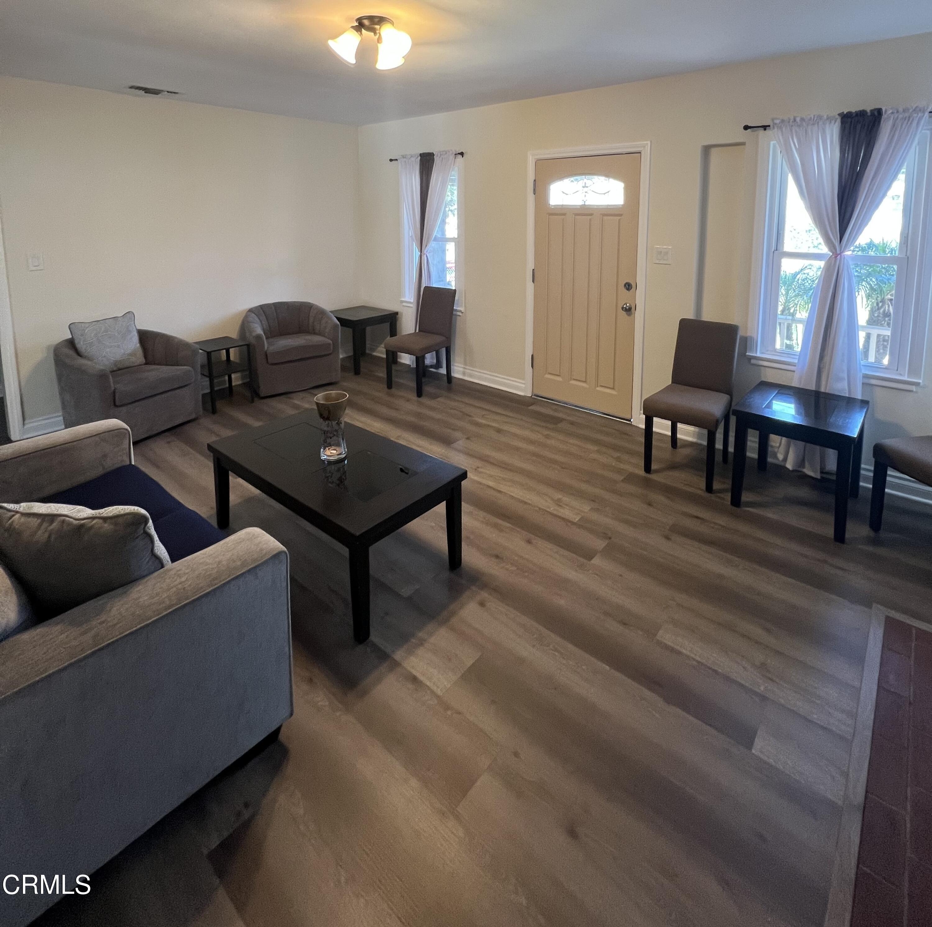 7618 Summitrose Street Tujunga, CA 91042 - Photo 5 of 15 a living room with furniture and a potted plant