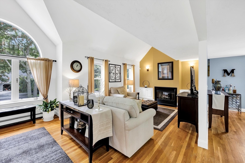 19 Drew Lane Mashpee, MA 02649 - Photo 12 of 42 a living room with furniture and a wooden floor
