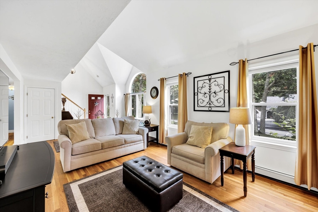 19 Drew Lane Mashpee, MA 02649 - Photo 13 of 42 a living room with furniture and a large window