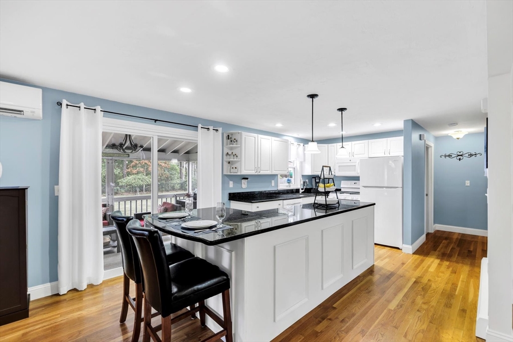 19 Drew Lane Mashpee, MA 02649 - Photo 14 of 42 a kitchen with stainless steel appliances granite countertop a sink and a stove