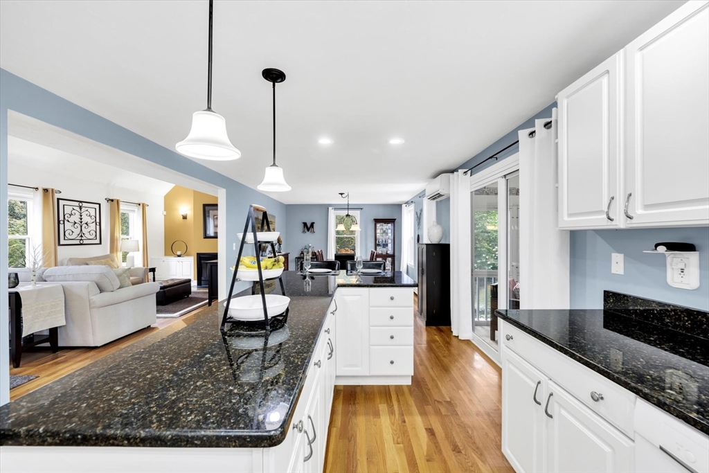 19 Drew Lane Mashpee, MA 02649 - Photo 17 of 42 a living room with furniture and a wooden floor