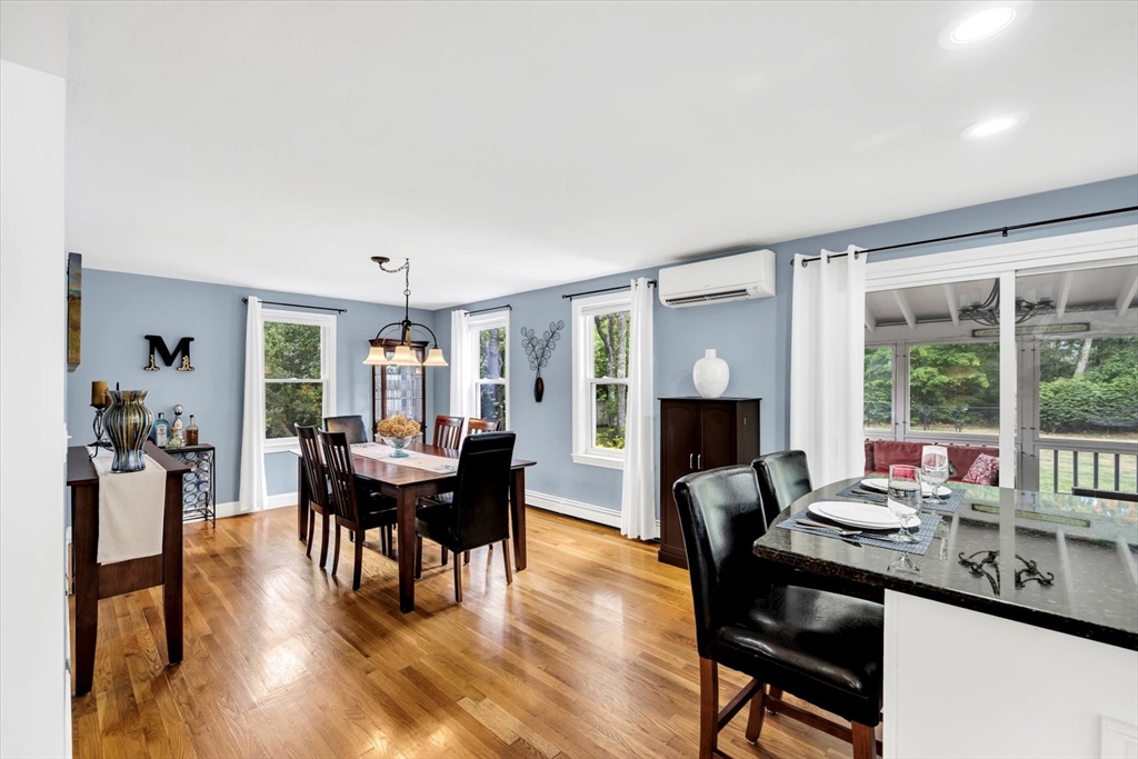 19 Drew Lane Mashpee, MA 02649 - Photo 19 of 42 a dining room with furniture garden view and a chandelier