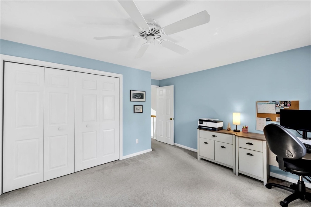 19 Drew Lane Mashpee, MA 02649 - Photo 32 of 42 a view of a workspace with furniture and a ceiling fan