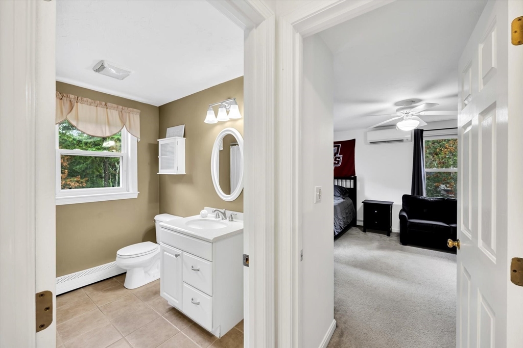 19 Drew Lane Mashpee, MA 02649 - Photo 34 of 42 a spacious bathroom with a double vanity sink toilet and a window