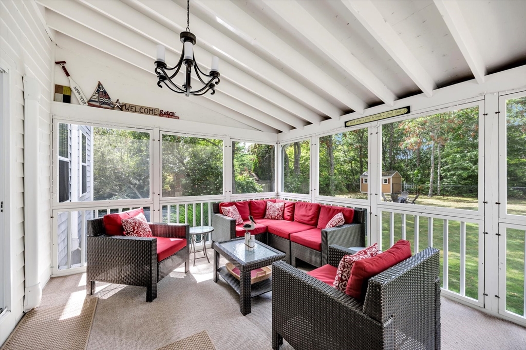 19 Drew Lane Mashpee, MA 02649 - Photo 38 of 42 a living room with furniture fireplace and large windows