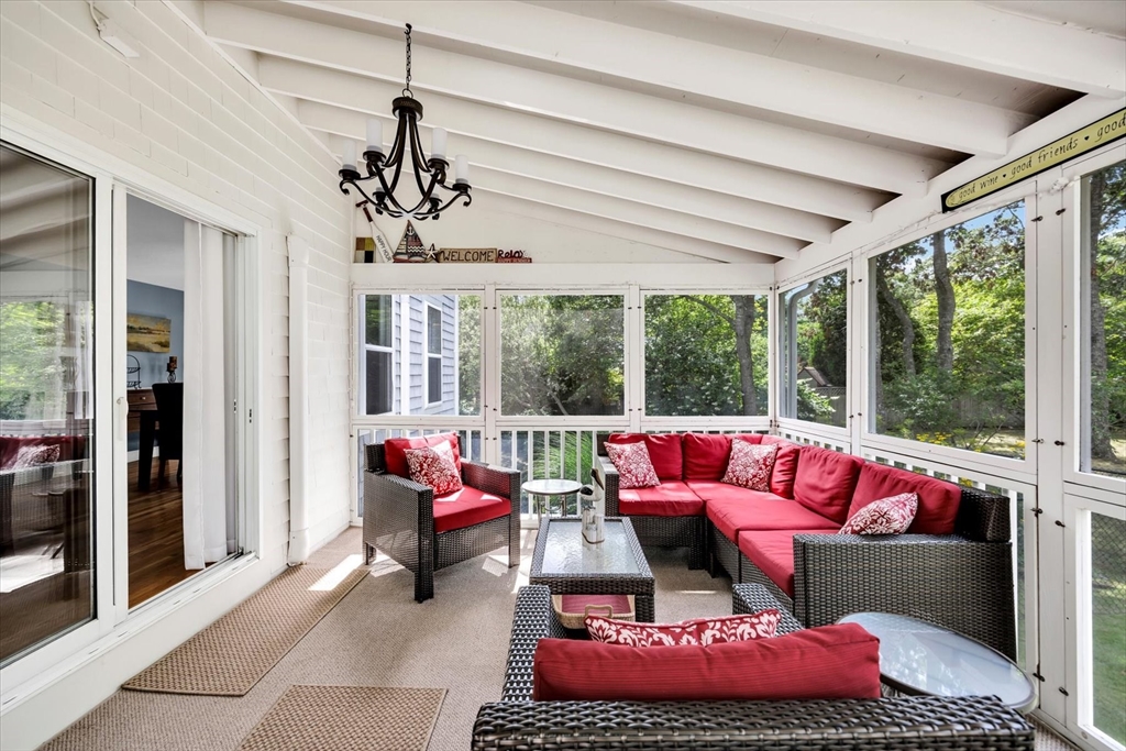 19 Drew Lane Mashpee, MA 02649 - Photo 39 of 42 a living room with furniture and a large window
