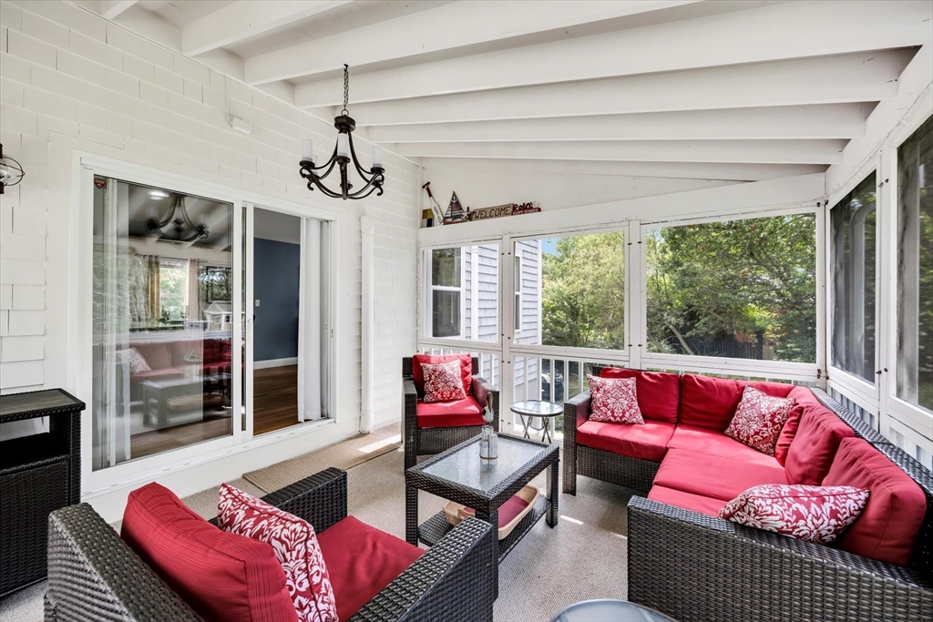 19 Drew Lane Mashpee, MA 02649 - Photo 40 of 42 a living room with furniture and a large window