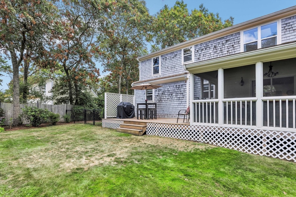 19 Drew Lane Mashpee, MA 02649 - Photo 7 of 42 a view of a house with a yard