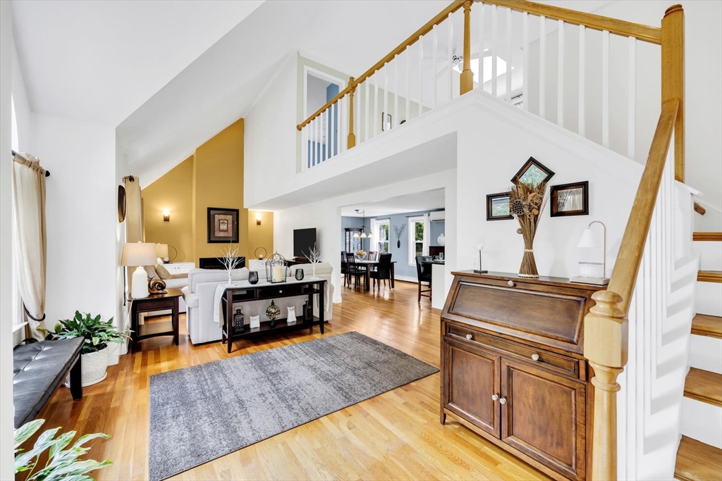 19 Drew Lane Mashpee, MA 02649 - Photo 10 of 42 a living room with furniture and a table