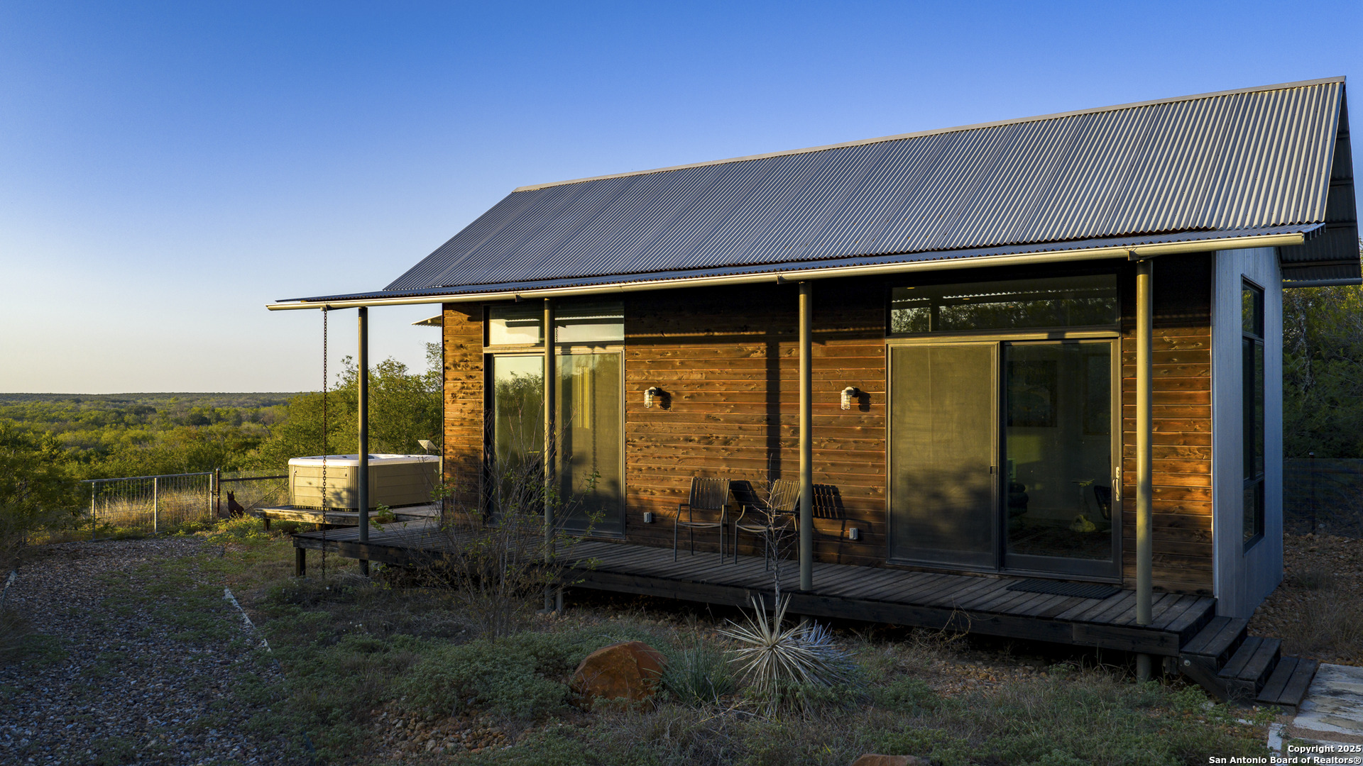 514 County Road 669 Devine, TX 78016 - Photo 17 of 45 a backyard of a house with yard table and chairs