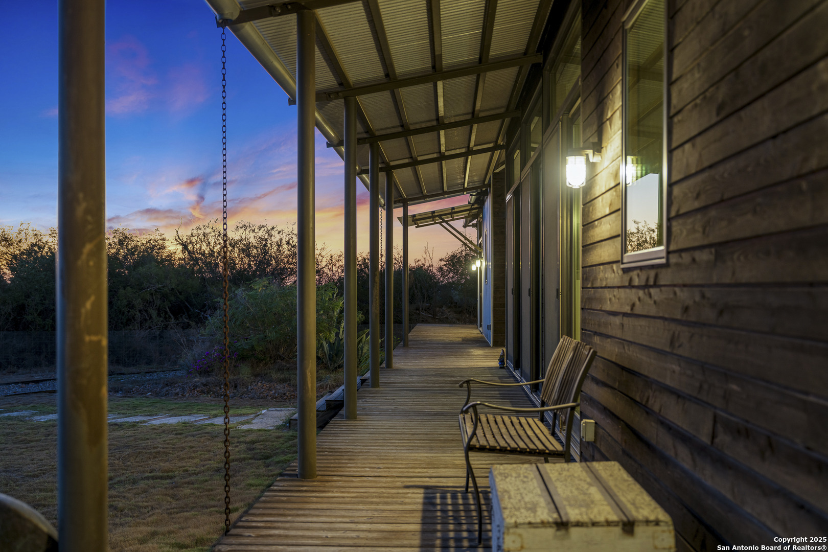 514 County Road 669 Devine, TX 78016 - Photo 26 of 45 a view of a door with wooden floor and iron stairs
